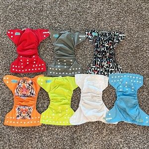 14 Alva Baby Cloth Diapers, Inserts, and waterproof Laundry Bag.